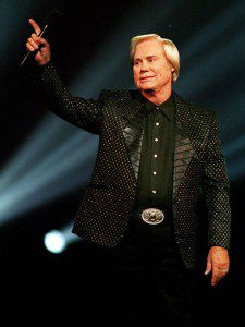 George Jones salutes the crowd at a 1993 event in Nashville. (Photo by the Associated Press' Mark Humphrey) 
