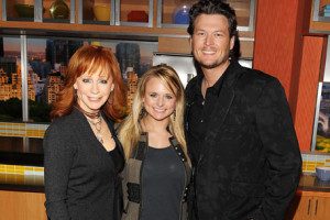 Blake Shelton recruited music giants Miranda Lambert and Reba to help heal the heartland during his concert for the Moore Tornado victims.  (Photo by Andrew H. Walker, Getty Images)