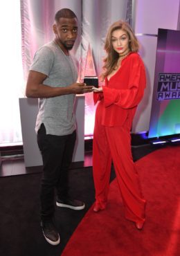 Hosts Jay Pharaoh & Gigi Hadid posed with an American Music Award. (Photo property of ABC & Dick Clark Productions) 