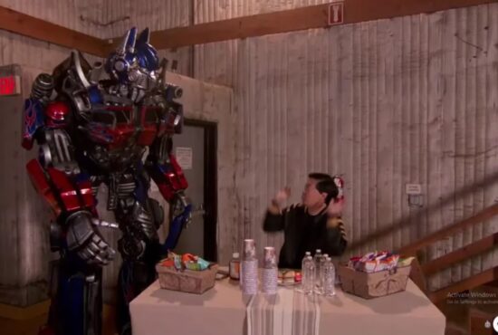Optimus Prime crossed paths with Ken Jeong backstage at The Masked Singer. (Photo property of FOX)
